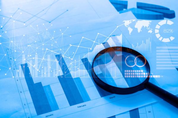 magnifying glass on the charts and graphs
